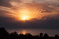 Sunset clouds palm trees silhouette horizon Royalty Free Stock Photo