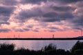 Sunset clouds and pink sky over the salt ponds of South San Francisco Bay Area; Sunnyvale, California Royalty Free Stock Photo