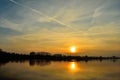Sunset and clouds in the sky over a Polish lake. Royalty Free Stock Photo