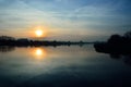 Sunset and clouds in the sky over a Polish lake. Royalty Free Stock Photo
