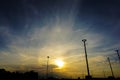 Sunset and clouds in the sky with silhouette lamp post