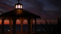 Sunset cloudscape, gazebo on beach, twilight dusk, dramatic sky. Alcove and vane Royalty Free Stock Photo