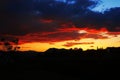 Sunset, cloudy sky background over night city. Nature.