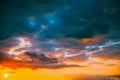 Sunset Cloudy Sky With Fluffy Clouds. Sunset Sky Natural Background. Sunrays, sunray, ray, Dramatic Sky. Sunset In Royalty Free Stock Photo