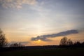 Sunset cloudy sky with picturesque clouds lit by warm sunset sunlight, colorful sunset sky with dramatic sky clouds lit Royalty Free Stock Photo