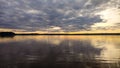 Sunset at coast of the Peaceful lake.reflection in a water.Silent Place.Sky with amazing colorful clouds. Water reflections.Magic Royalty Free Stock Photo