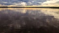 Sunset at coast of the Peaceful lake.reflection in a water.Silent Place.Sky with amazing colorful clouds. Water reflections.Magic Royalty Free Stock Photo