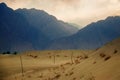 Sunset at cold desert with beutiful layer of mountains Royalty Free Stock Photo