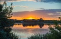 Sunset colorful sky and shining water. Beautiful lake. Countryside landscape.