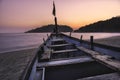 Sunset colorfull pink and violet in a tropical beach goa india with blu boat and island Royalty Free Stock Photo