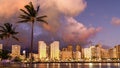 Sunset colors reflect from Honolulu buildings and clouds Royalty Free Stock Photo