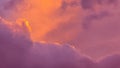 Sunset colours in the sky with impressive cloud formations in orange and violet tones Royalty Free Stock Photo