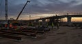 Sunset Construction Workers Building Bridge, Industrial Scene Royalty Free Stock Photo