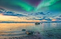 Sunset on the Cook Inlet in Alaska with the Northern Lights Appearing in the Sky over the Mountains Royalty Free Stock Photo