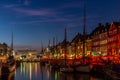 Sunset in Copenhagen on the old, colorful and busy harbor of Nyhavn Royalty Free Stock Photo