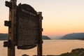 Sunset at the Corbett viewpoint of the Columbia River with a sign of historical point of Oregon