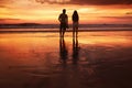 Sunset Couple. Silhouettes Of Young Man And Woman Staying Together At Beach. Vacation Or Honeymoon Concept. Royalty Free Stock Photo