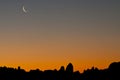 Sunset And Crescent Moon