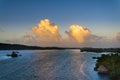 Sunset cumulus clouds on tropical horizon.