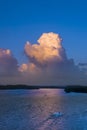 Sunset cumulus clouds on tropical horizon.