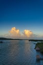 Sunset cumulus clouds on tropical horizon