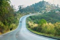 Sunset on curve road in the mountain and forest, country road of Nan in north of Thailand