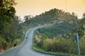 Sunset on curve road in the mountain and forest, country road of Nan in north of Thailand Royalty Free Stock Photo