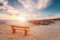 Sunset in Cyprus - Mediterranean Sea coast. Sea Caves near Ayia Napa. the bench in the background of space. you can sit