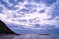 Sunset on the Danish coast. Beach, waves. Hill with trees in background. Landscape Royalty Free Stock Photo