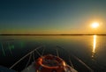 Sunset in the Danube delta Romania.Beautiful blueish lights in water.Beautiful sunset landscape from the Danube Delta Biosphere Re