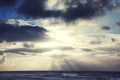 Sunset with dark clouds and blue sky over the sea Royalty Free Stock Photo