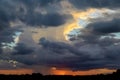 Sunset with dark clouds, rain, tornado or hurricane Royalty Free Stock Photo