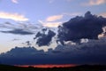 A sunset with dark rain clouds in summer Royalty Free Stock Photo