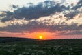 Sunset dawn sunrays over the city sky field flowers Royalty Free Stock Photo