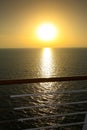 Sunset from the deck of a cruise ship with reflections over the sea, cruising the Indian Ocean Royalty Free Stock Photo