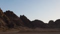 Sunset in the desert in Egypt. Mountain cliff in the desert at sunset. Nature and landscape Royalty Free Stock Photo