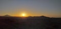 Sunset in desert with volcans Royalty Free Stock Photo