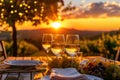 Sunset dining setup with wine glasses in a vineyard Royalty Free Stock Photo