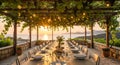 Sunset Dinner by the Sea with Grapevine Pergola Royalty Free Stock Photo
