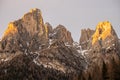 Sunset in the Dolomites, Italy. The peaks are illuminated by the setting sun. Winter mountains in Civetta, Italian dolomites Royalty Free Stock Photo