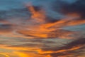 Sunset in dramatic blue sky with clouds in orange color tones Royalty Free Stock Photo