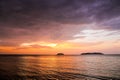 Sunset with dramatic clouds on the tropical beach Royalty Free Stock Photo