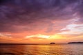 Sunset with dramatic clouds on the tropical beach Royalty Free Stock Photo