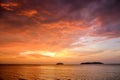 Sunset with dramatic clouds on the tropical beach