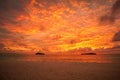 Sunset with dramatic clouds on the tropical beach. Royalty Free Stock Photo