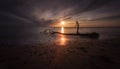 Sunset and driftwood on Sker Beach Royalty Free Stock Photo