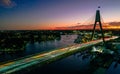 Sunset drone view over Anzac Bridge Cable-stayed in Sydney, Australia with purple sky Royalty Free Stock Photo