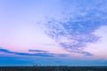 Sunset dusk blues and pinks color over Sydney CBC with clouds fanning out into the sky