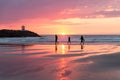 Sunset at the Dutch coast near Scheveningen with passing walkers