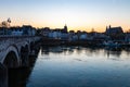 Sunset in early April with a view on the river Meuse, the old roman Sint Servaas bridge in Maastricht Royalty Free Stock Photo